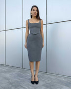 Fustă midi femei tip creion gri elegantă și confortabilă din stofă elastică.